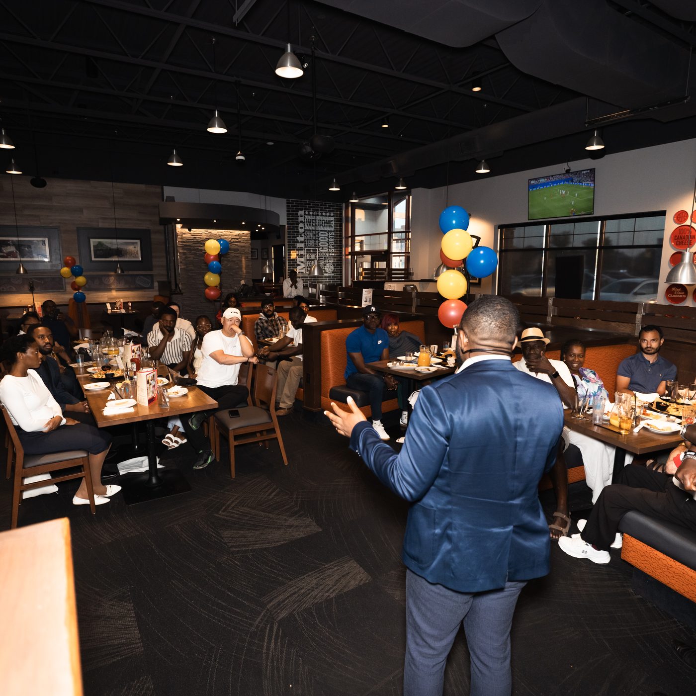 Arthur addressing a packed room at The Glory of Milton campaign launch, Boston Pizza Milton